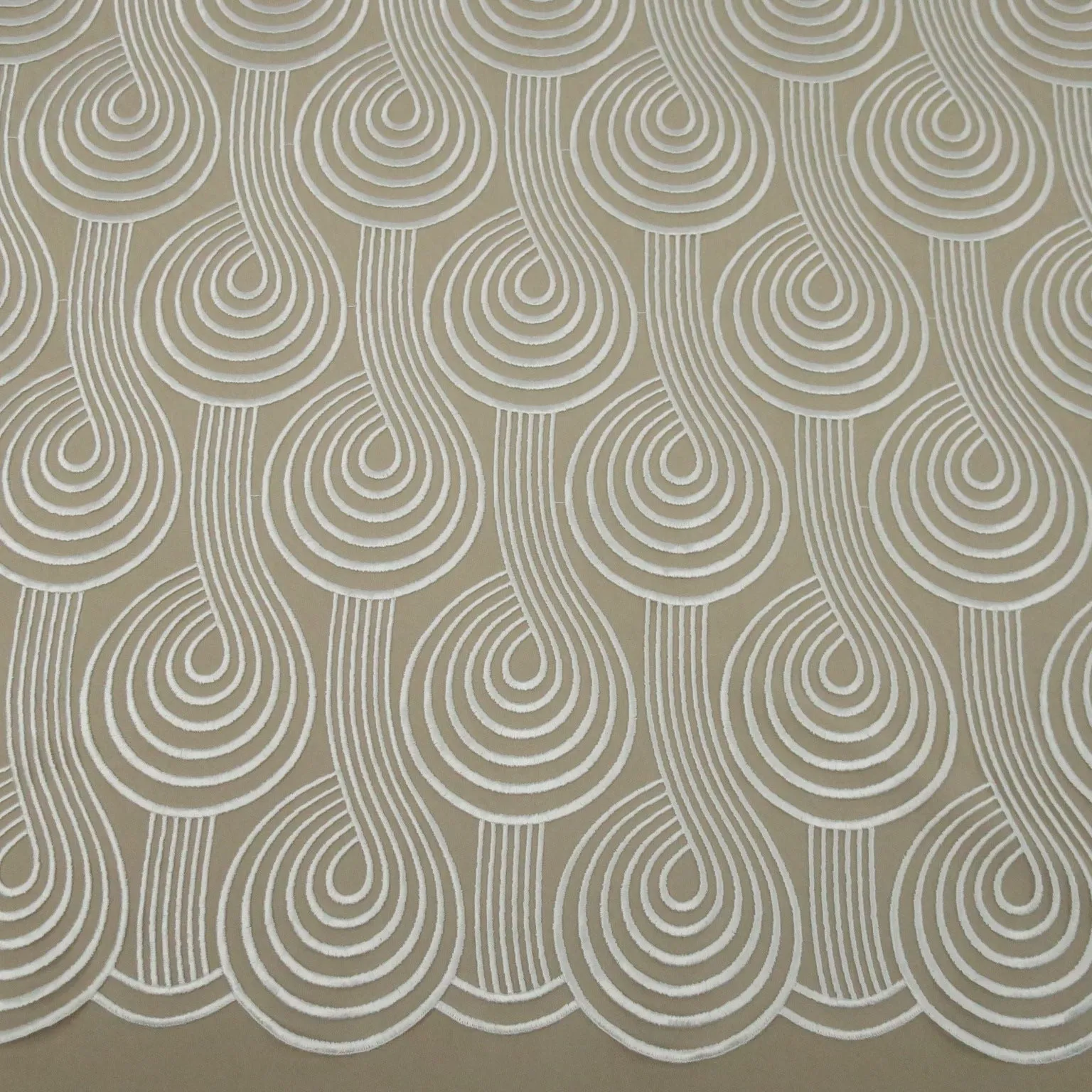 Ivory Swirls Embroidered Tulle Fabric